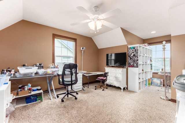 carpeted office featuring vaulted ceiling and ceiling fan