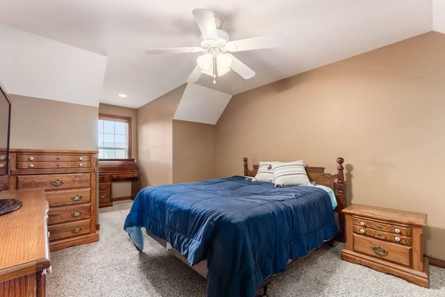 carpeted bedroom featuring ceiling fan and lofted ceiling