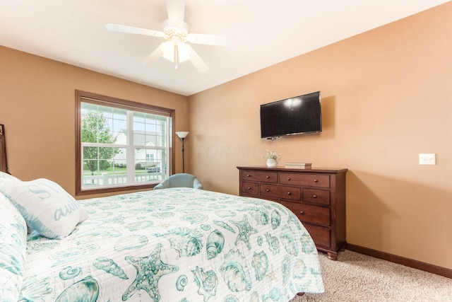 bedroom featuring ceiling fan and light carpet