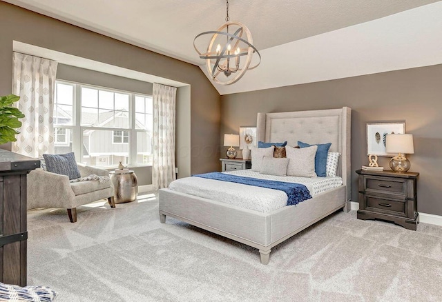 bedroom with a chandelier, carpet, vaulted ceiling, and baseboards