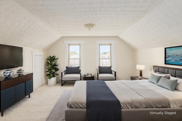 carpeted bedroom with vaulted ceiling