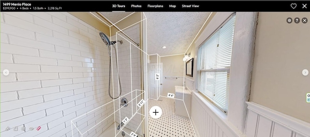 bathroom with a tile shower