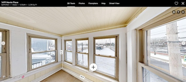 unfurnished sunroom with wood ceiling