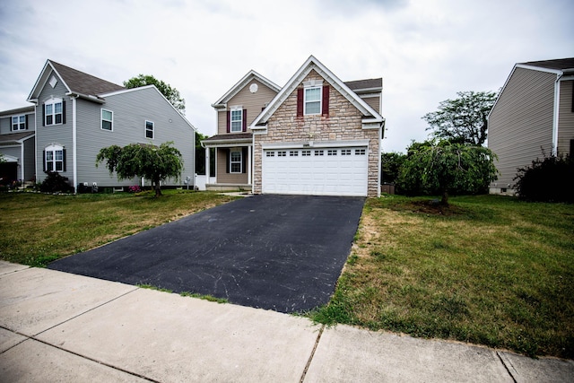 view of front of home featuring a front yard and a garage