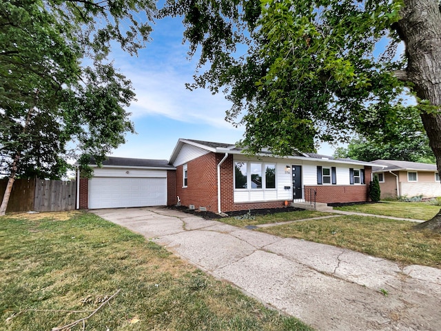 ranch-style home with a front yard and a garage