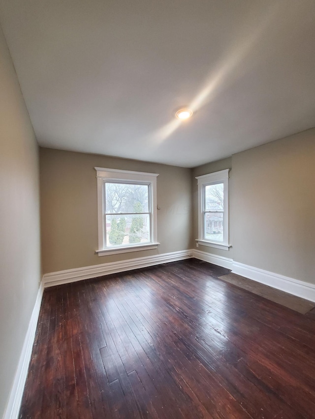 unfurnished room featuring dark hardwood / wood-style floors