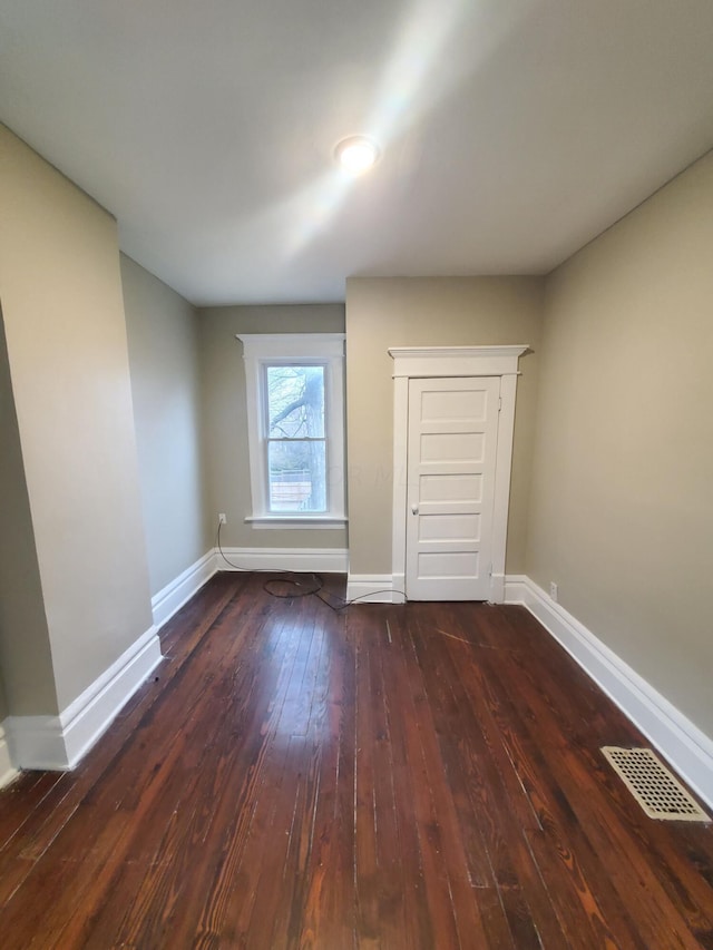 interior space with dark wood-type flooring