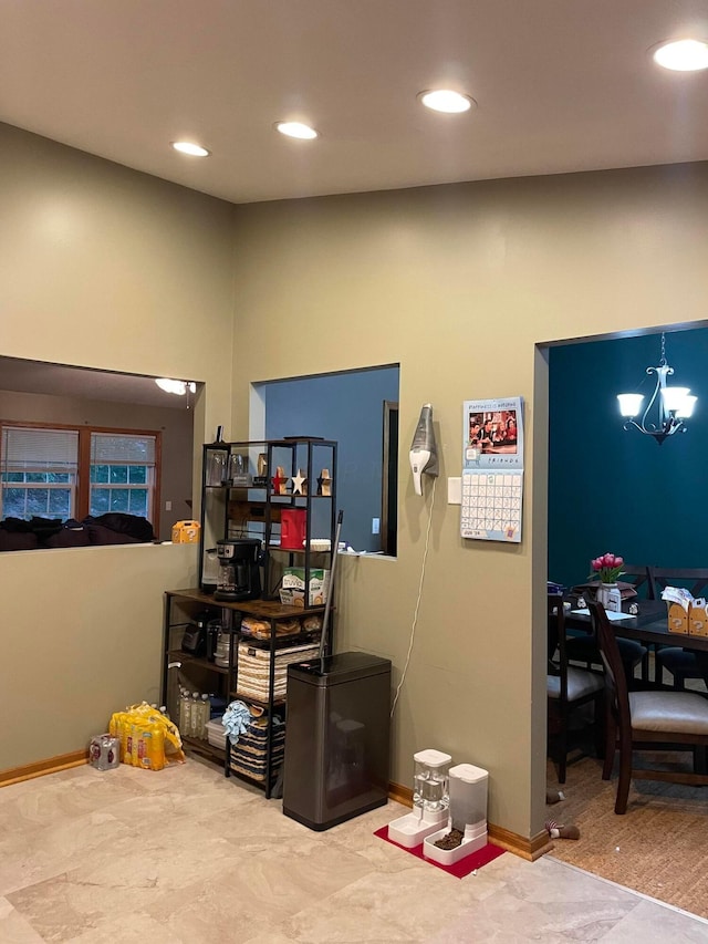 interior space with pendant lighting and a chandelier