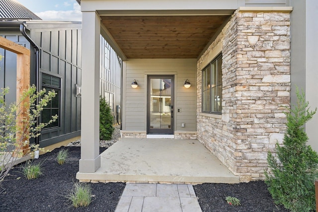 view of exterior entry with stone siding