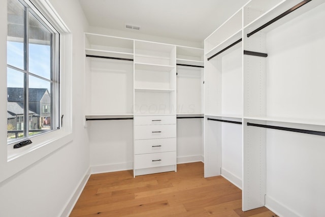 walk in closet with visible vents and light wood-style flooring