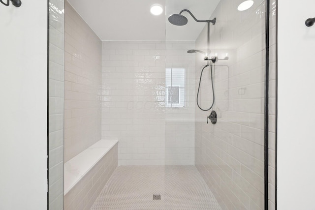 bathroom with tiled shower