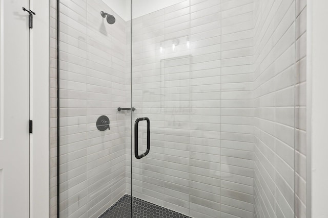 full bathroom featuring a shower stall