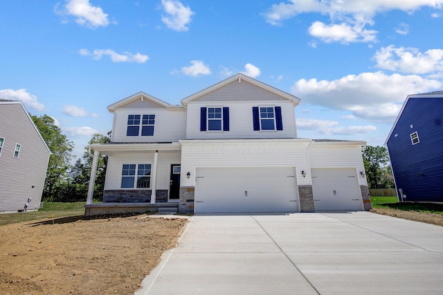 view of front of home with covered porch and a garage