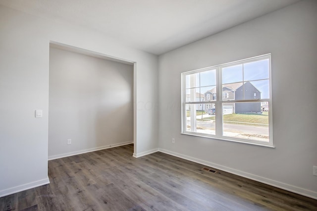 empty room featuring hardwood / wood-style floors