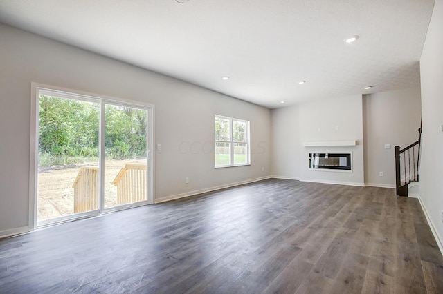 unfurnished living room with hardwood / wood-style flooring