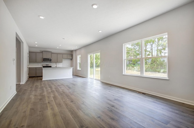 unfurnished living room with hardwood / wood-style floors