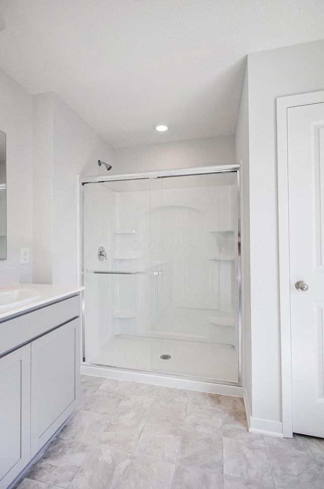 bathroom with vanity and an enclosed shower