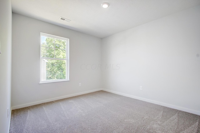 unfurnished room with carpet floors