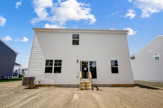 rear view of house with central AC