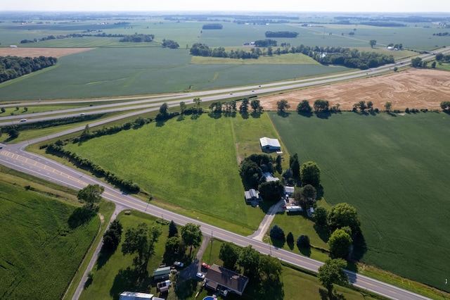 drone / aerial view featuring a rural view and a water view