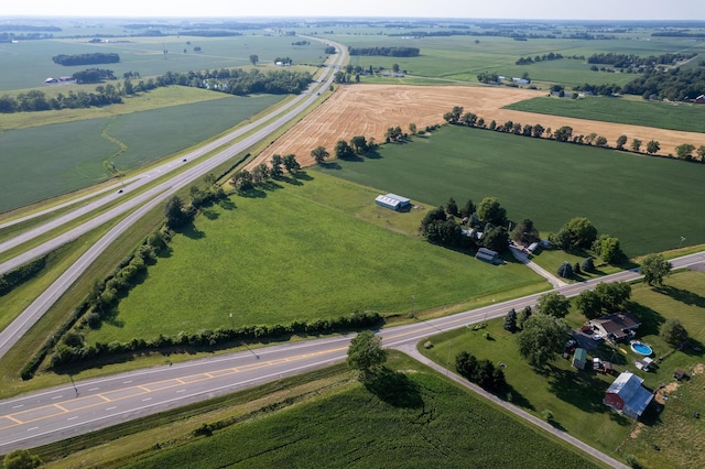 birds eye view of property with a rural view