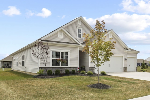 view of front of home with a front yard and a garage