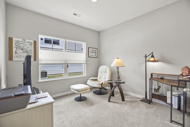 living area with light carpet