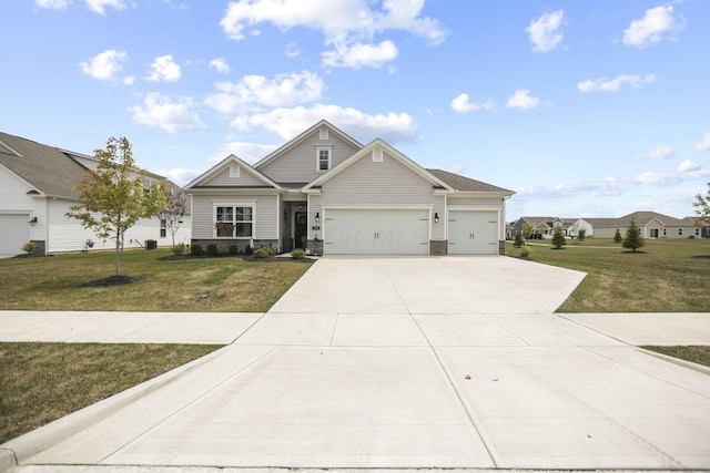 view of front of home featuring a garage and a front lawn