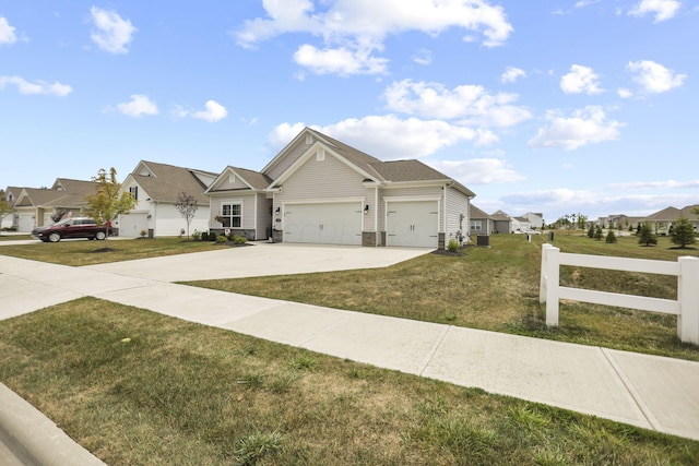 view of front of home with a front lawn and a garage