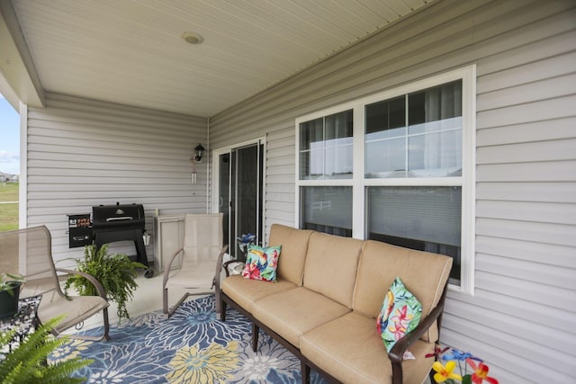 view of patio featuring an outdoor living space and a grill