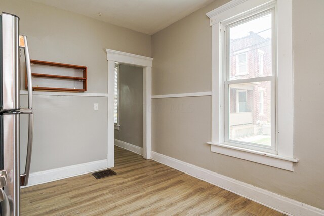 spare room with light hardwood / wood-style floors