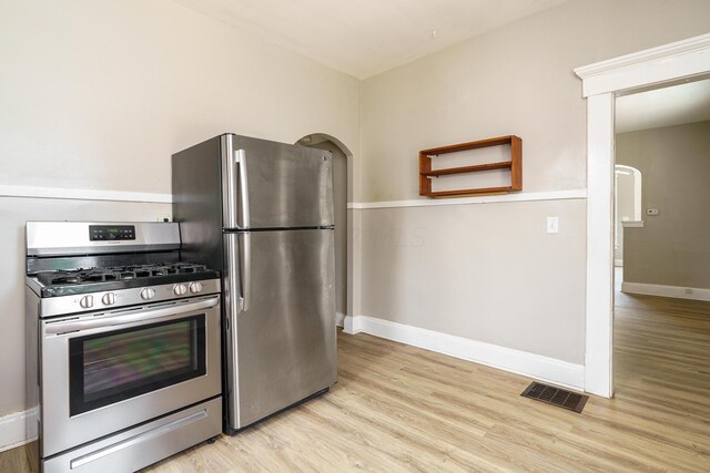 kitchen featuring stainless steel appliances and light wood-type flooring