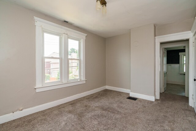 spare room with light colored carpet