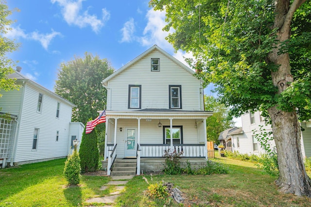 view of front of property with a front lawn and a porch