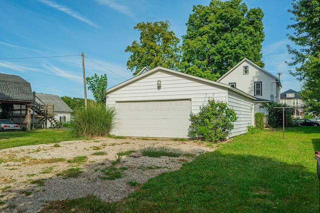 garage featuring a lawn