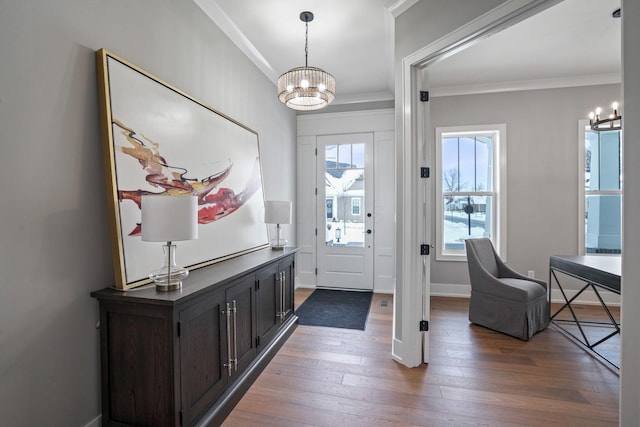 entryway featuring a chandelier, dark hardwood / wood-style flooring, and a healthy amount of sunlight