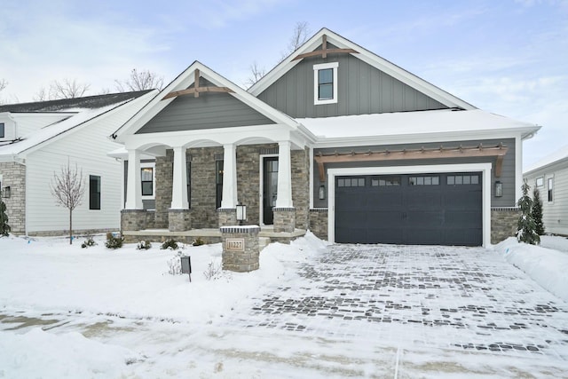 craftsman-style house featuring a garage and covered porch