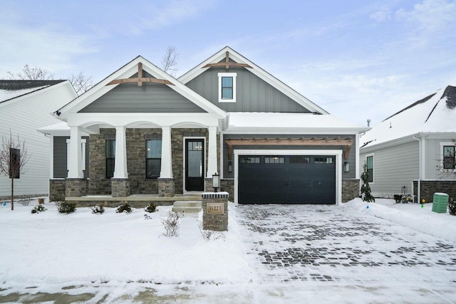 craftsman inspired home with a porch and a garage