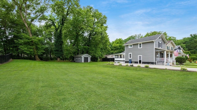 view of yard with a storage unit and a porch