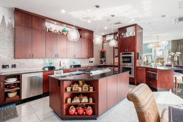 kitchen with pendant lighting, decorative backsplash, a center island, and stainless steel appliances