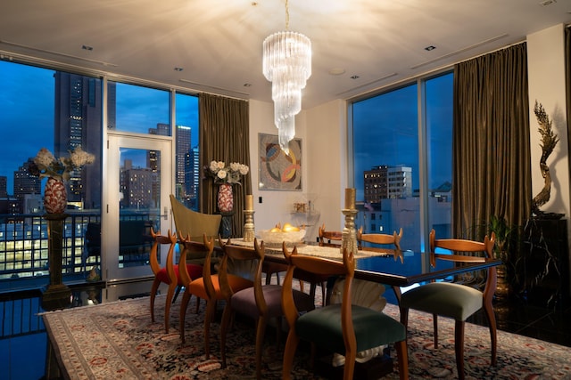 dining area featuring expansive windows and an inviting chandelier