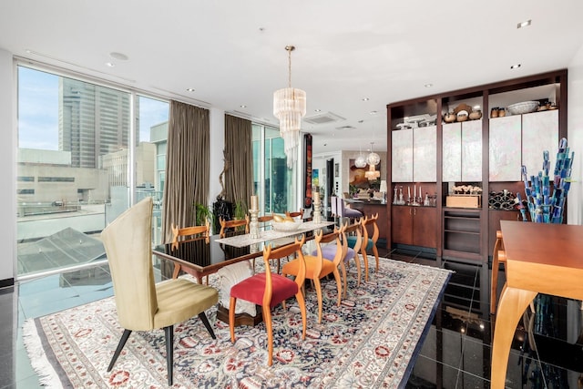 dining space featuring tile patterned floors and a chandelier