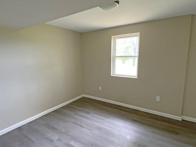 spare room with light hardwood / wood-style flooring