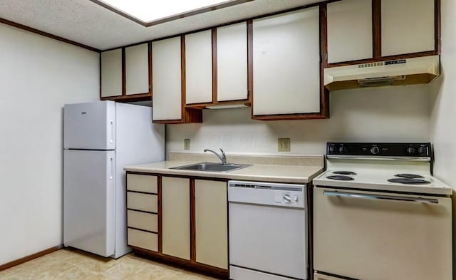 kitchen featuring white cabinets, a textured ceiling, white appliances, and sink