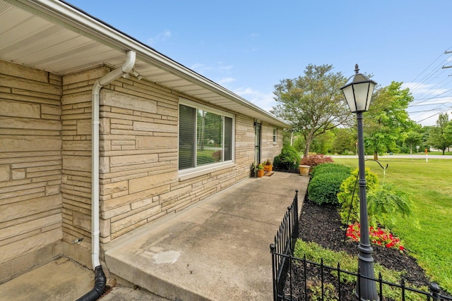 view of side of property featuring a yard