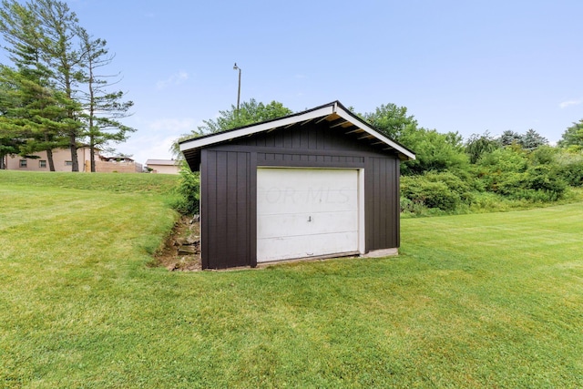 garage featuring a lawn