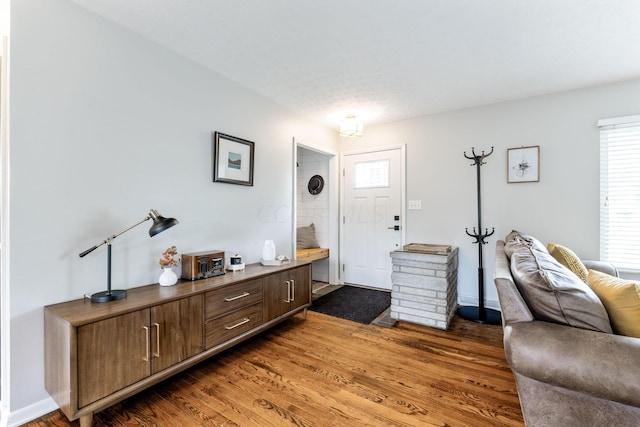 entryway with dark hardwood / wood-style floors