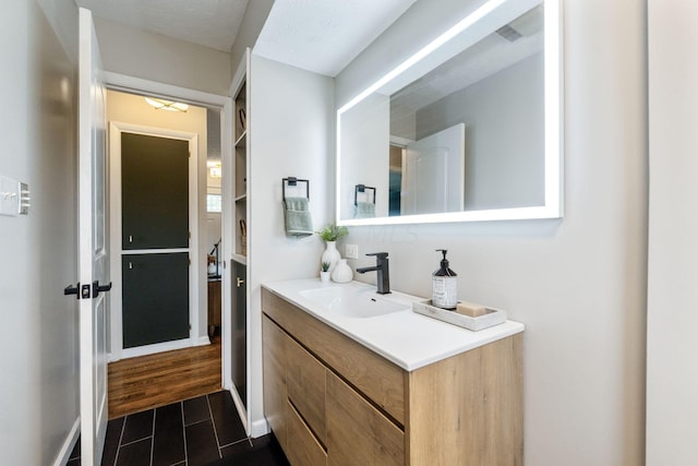 bathroom featuring vanity and a textured ceiling