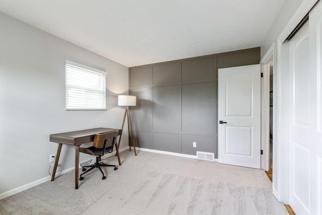 office area with light colored carpet