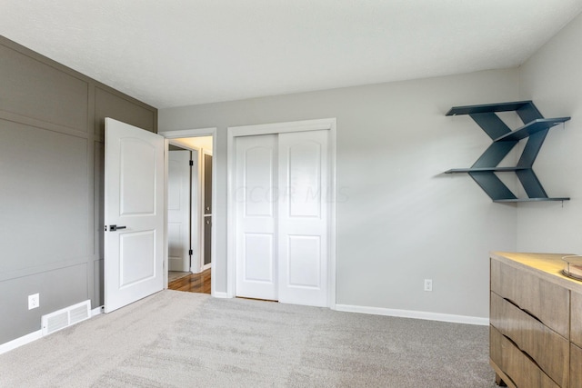 bedroom featuring a closet and carpet